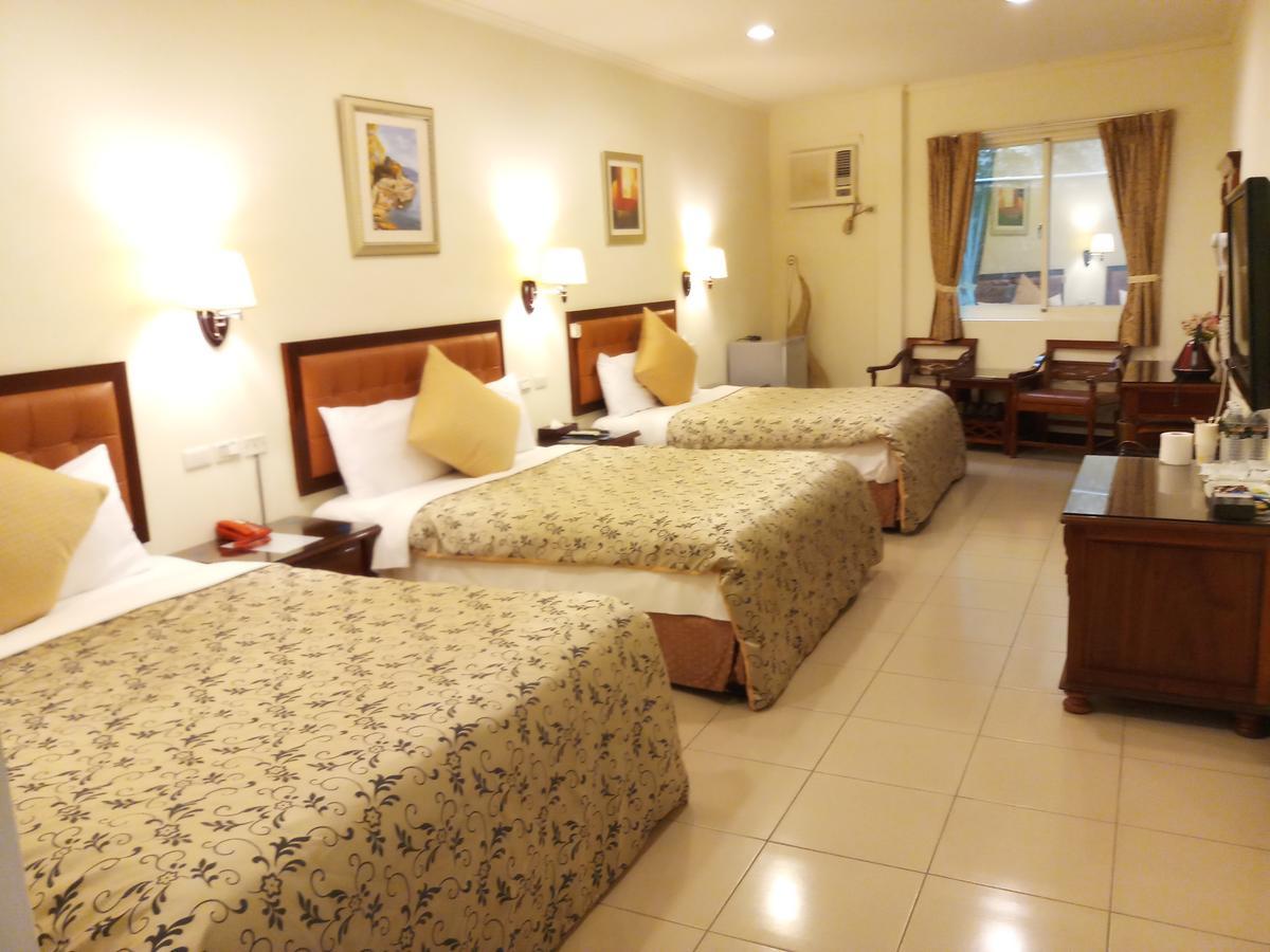 Puti Commercial Hotel Лонгтан Экстерьер фото